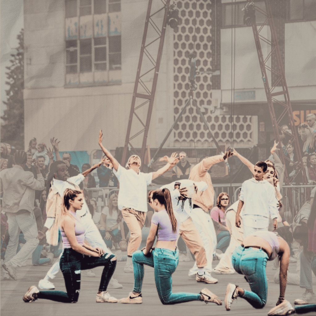 image of a dance festival with dance crew performing and shows installations