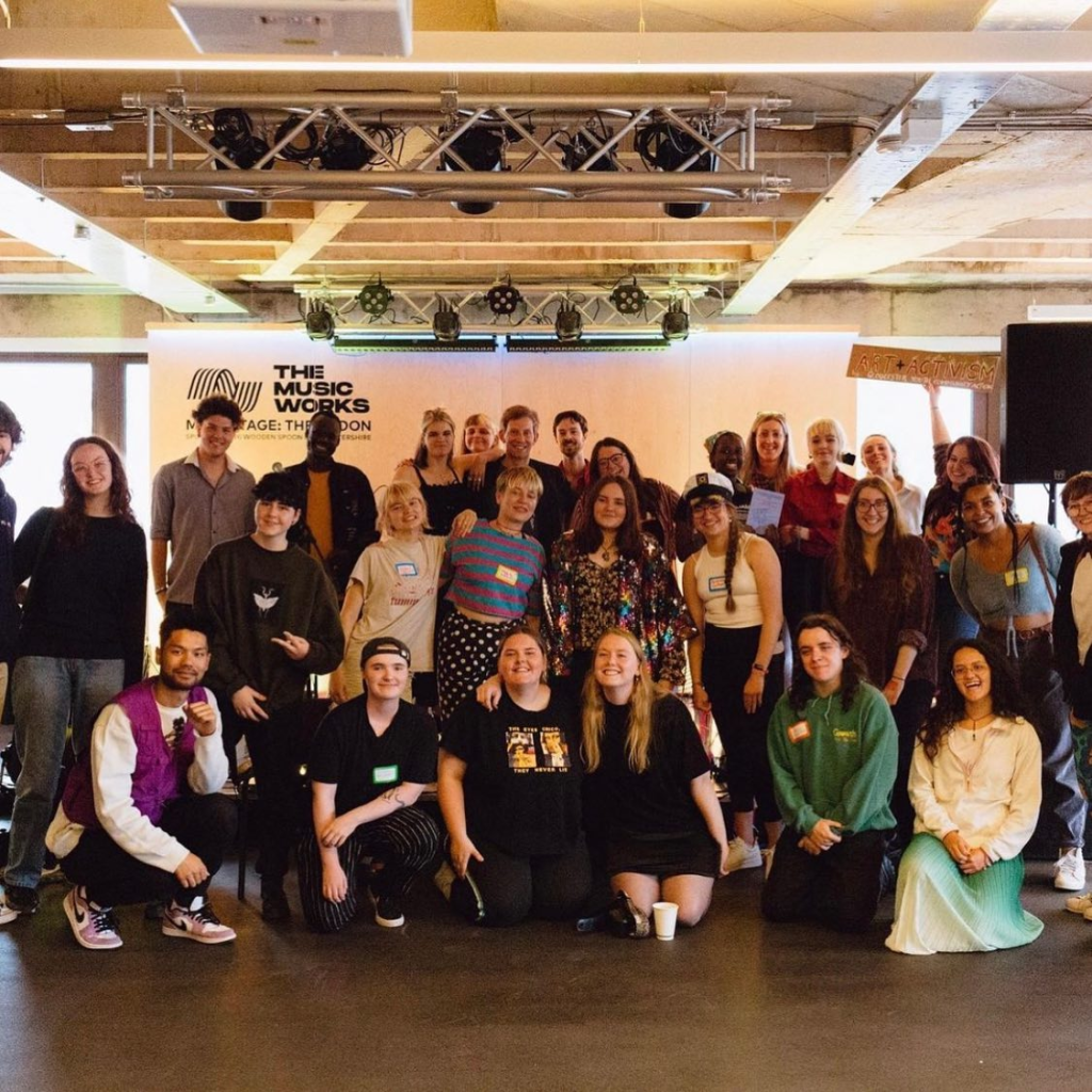 a big group photo of the 60 attendees of WCID 2022