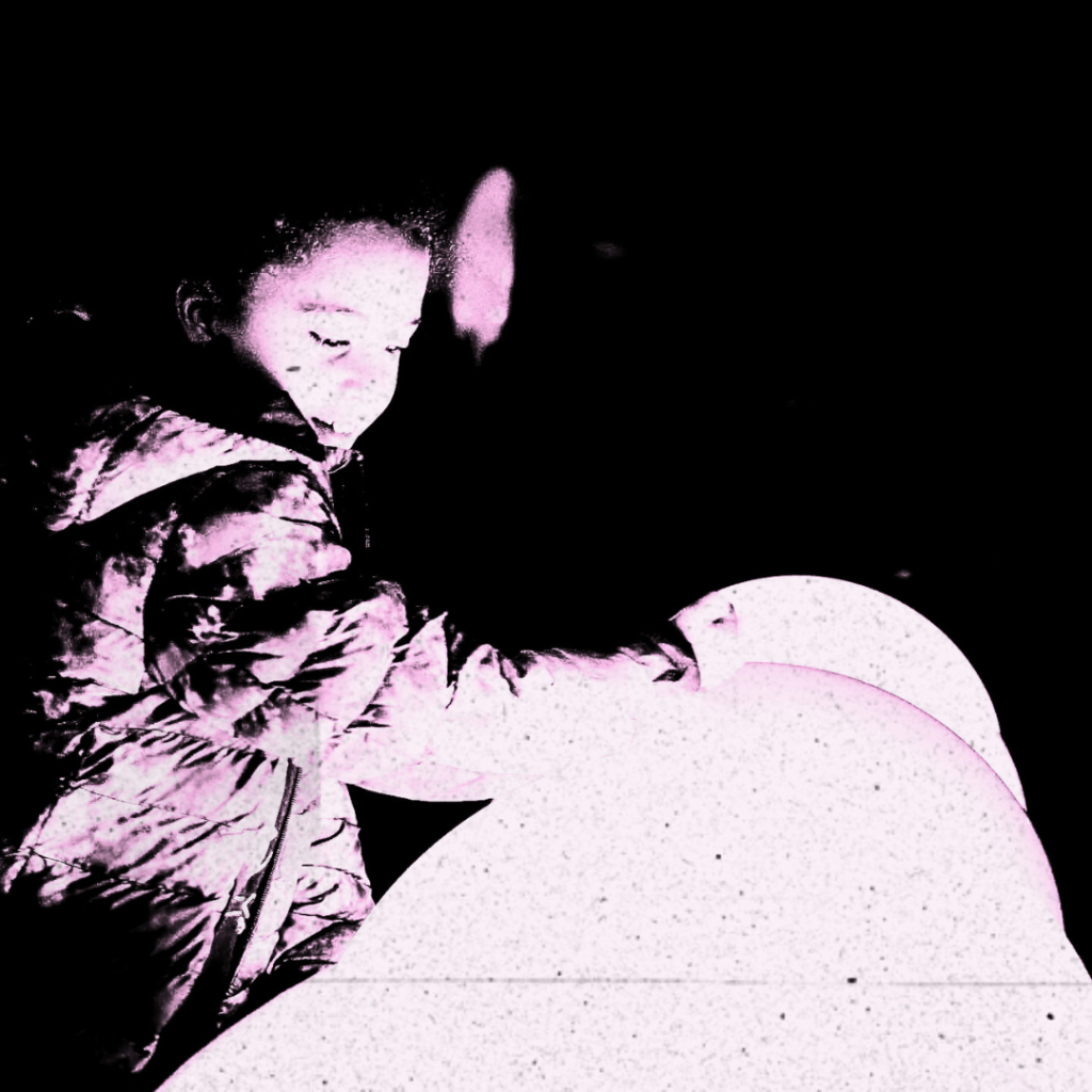 A girl admiring big globe lights at Light Games event in Matson in 2023